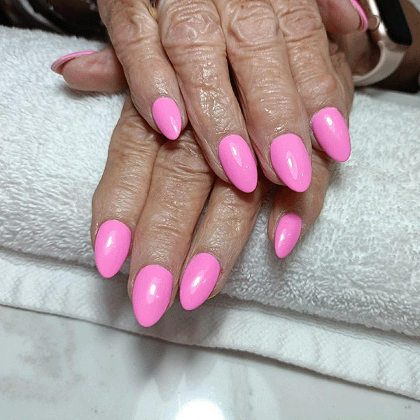 Almond-shaped nails in glossy bright pink.