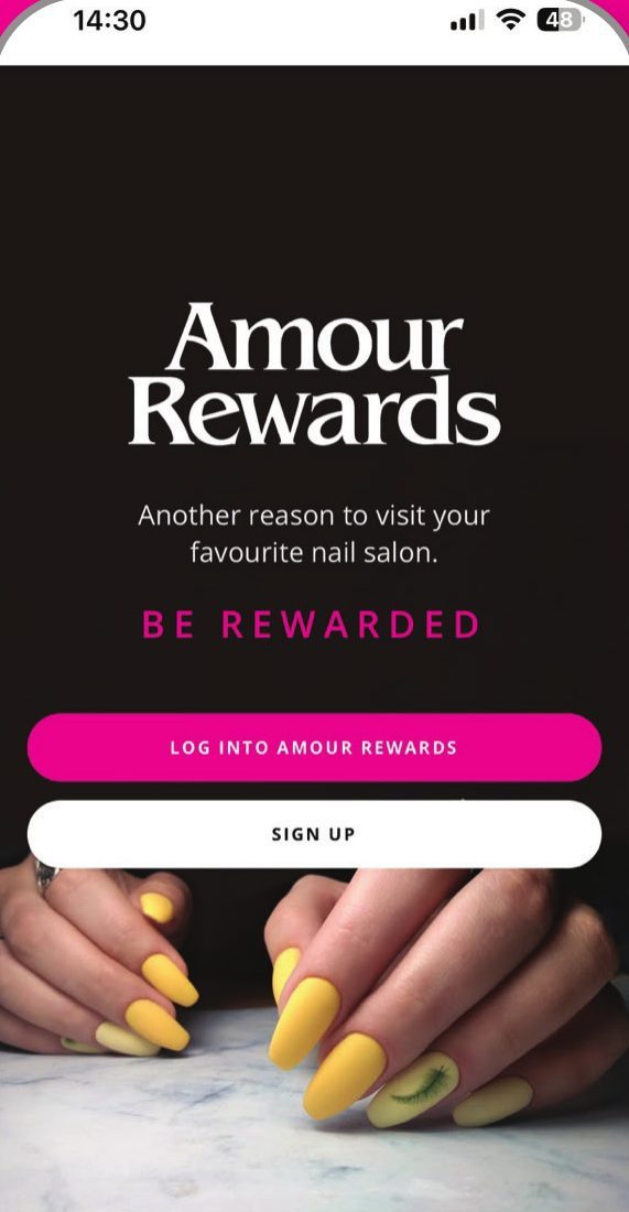 The Amour Rewards app open on a phone, with buttons to log in or sign up.
